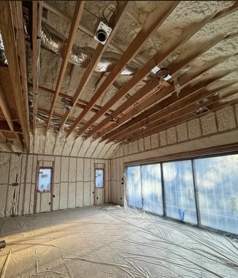 Interior walls and ceiling insulated with spray foam during new construction in Fowler
